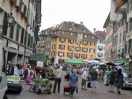 The bustling street of Hauptgasse in Solothurn, looking away from the cathedral